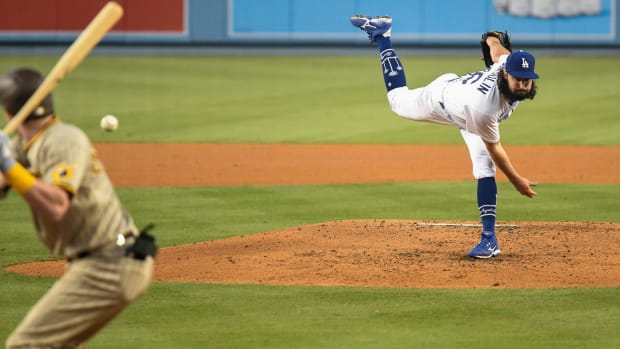 Aug 12, 2020; Los Angeles, California, USA; Los Angeles Dodgers starting pitcher Gonsolin (46) throws to San Diego Padres shortstop Jake Cronenworth (9) during a Dodger victory over the Padres at Dodger Stadium. Mandatory Credit: Robert Hanashiro-USA TODAY Sports
